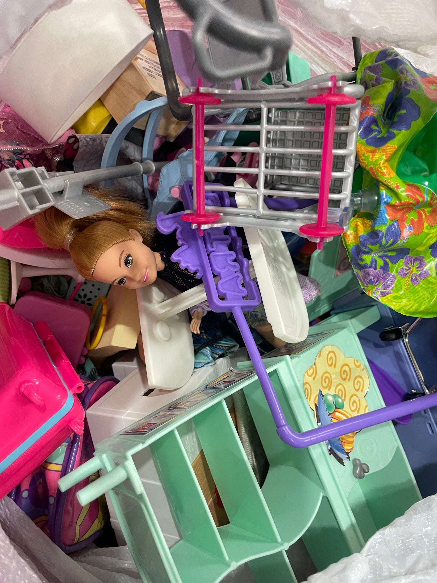 Trash bag of Barbie accessories